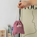 Detail of pink corduroy drawstring pouch showing soft fabric texture and cotton rope - Dusty Pink
