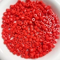Close-up of 6mm cylindrical red acrylic loose beads for DIY phone chain jewelry making - Vermilion