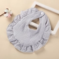 Close-up of light purple cotton gauze baby bib with ruffle edges and snap button - Blue Gray