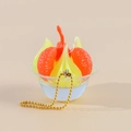 Miniatuur oranje gelei dessert sleutelhanger met oranje schijfjes en gouden ketting - Geel