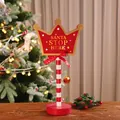 Wooden 30x11cm Santa Stop Here road sign decor with LED lights and red white striped pole - Crown