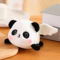 Cute plush panda doll with white wings and pink blush in a cozy lifestyle setting - Panda 12cm