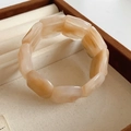 Detail of wide elastic bracelet featuring cream and amber marble acrylic textures - Light Coffee Marble