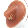 Golden dollar sign nose stud with sparkling cubic zirconia on a realistic silicone model - Gold Dollar Sign