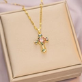 Golden cross pendant necklace featuring colorful crystals and a pink oval center stone - 6054 Cross Color Zircon / Gold