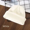 Classic creamy white rib-knit beanie hat for winter outdoor warmth and comfort - White