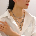 Silver layered necklace featuring black oval gemstones and a delicate round charm pendant - Silver Double Layer Disc Necklace Combination (32)