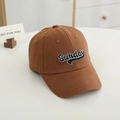 Close-up of brown cotton baseball cap with white Sunday embroidery and fine twill texture - 52CM (2-6 Years) / Coffee