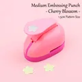 Pink medium DIY paper puncher for kids craft, creating 1.5cm cherry blossom shapes - Medium Cherry Blossom