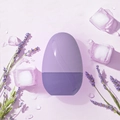 Purple egg-shaped ice roller with wave texture, lavender sprigs and ice cubes background - New Egg Shape - Purple
