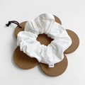 Classic white fabric scrunchie with brand tag on a flower shaped cork base - Large / White