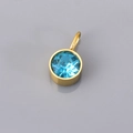 Minimalist gold-framed round charm with a faceted blue birthstone and top ring loop - Round Pendant / Light Blue