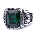 Macro detail of vintage gothic ring featuring a large emerald green stone on carved steel - US Size 7 / Green Gemstone