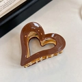Brown heart-shaped resin hair clip with golden metal spring for elegant styling - Brown Heart Claw