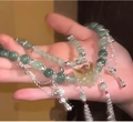 Bracelet multicouche bohème avec perles vertes et breloques ailes en métal argenté - Style Pendentif Aile Cyan
