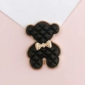 Macro detail of a black quilted bear charm with a gold bow and metallic gold border - Bowknot Bear(D1627) / Black