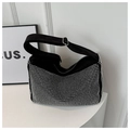 Sparkling black rhinestone messenger bag with a wide adjustable strap on a white stand - Silver