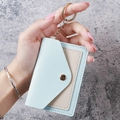 Light blue and beige faux leather card holder with gold keychain and snap button closure - Light Blue