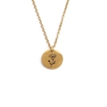 Close-up of golden stainless steel necklace with engraved floral pattern pendant - September
