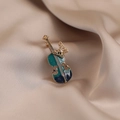 Elegant gold-tone violin brooch with gradient blue enamel and pearl butterfly detail - 575# Violin