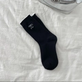 Women's black crew socks with elegant white ruffle trim and embroidered bow detail - Black