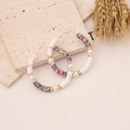 Bohemian rainbow polymer clay hoop earrings with pearls on a textured stone display - 6# Spotted Multicolor
