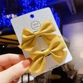 Pair of yellow fabric bow hair clips with cute synthetic braids for young girls - Ginger Yellow Bow (Hair Clip 024-Braid)