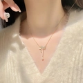 Elegant gold butterfly necklace with pearl tassels and zircon inlay on a model - Butterfly Style (LI364)