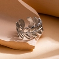 Macro shot of silver stainless steel leaf ring with polished texture on warm background - Leaf Design Style 10 / Steel