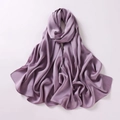 Detailed close-up of folded purple chiffon scarf showing smooth silk texture and sheen - Deep purple