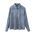 Detail of beaded floral embroidery on a blue-grey satin long-sleeved shirt for women - XS / Tops / Blue