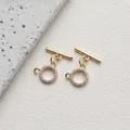 Macro shot of 14K gold plated OT toggle clasp with cubic zirconia pave for jewelry DIY - Style H Round Beaded Zirconia / 14K Gold