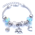 Silver zinc alloy charm bracelet with Tree of Life and elephant pendants and teal beads - Light Blue