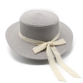 Close-up of summer boater hat featuring grey-purple straw texture and white lace bow detail - M (56-58cm) / Gray