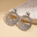 Macro detail of silver geometric drop earrings with sparkling rhinestones on marble - Silver (Silver Pin)