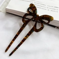 Modern butterfly acetate hair pin with dark tortoiseshell pattern and U-shaped design - Amber Brown