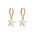Detail of gold-plated starfish drop earrings with micro-pave zircons and white enamel - White Starfish