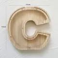 Letter C shaped wooden piggy bank with transparent acrylic panel and 17.5cm dimensions - Letter C