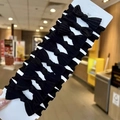 Close-up of ten black bow elastic hair ties displayed on a white cardboard retail card - 【10Pcs Card Pack】Bowknot Seamless (All Black)