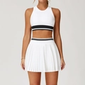 White two-piece athletic set with striped crop top and high-waisted pleated tennis skirt - Swan White / S