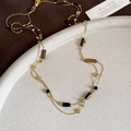 Close-up of vintage tiger eye stone beaded necklace on a premium textured display tray - 82# Gold Coffee Necklace