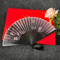 Classic Chinese folding fan with black frame, lotus print, tassel, and elegant gift box - Emerging Lotus - Black Handle