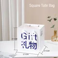 White gift bag with transparent window and blue Gift print in 27.5cm square size - GIFT (Square) / 27.5x27.5x27.5cm