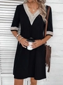 Detail of the V-neckline with beige crochet lace trim on a black casual loose dress - S / Bottoms / Black