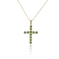 Detailopname van gouden kruis ketting met stervormige zetting van groene zirkoonstenen - Goud met groene edelsteen