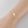 Elegant gold lightning bolt bracelet for women worn on wrist with minimalist style - 343-Lightning