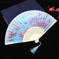 Blue folding fan with pink cherry blossoms, wooden carving, and matching tassel - No. 49
