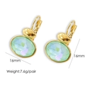 Detailed view of gold oval drop earrings with 16mm green crystals and 7.6g weight info - Light Blue