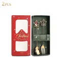 Close-up of golden Christmas spoons and forks with star pendants in a festive gift box - 304 Star Pendant Santa + Tree (2PCS Set) / Gold