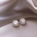 Classic silver halo stud earrings with round-cut zircon on beige satin background - Silver White Rhinestone